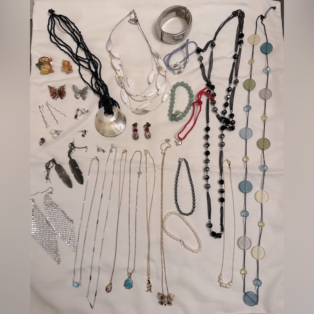 Assorted costume jewelry and hanging zipper bag